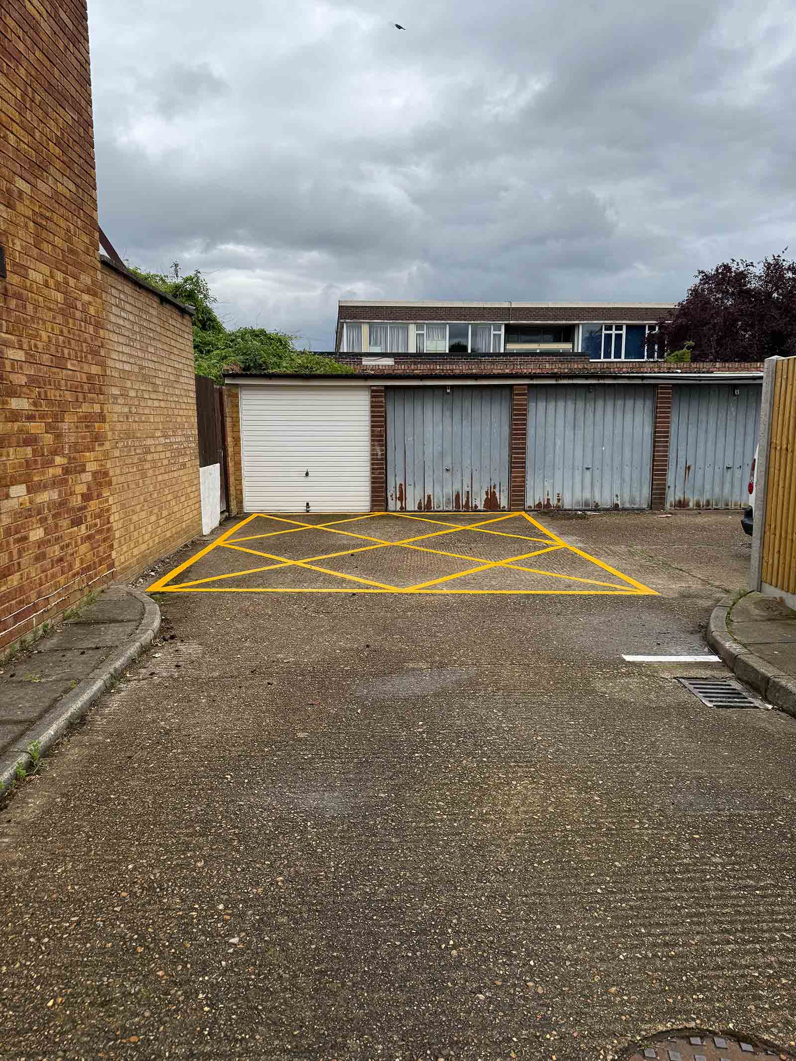 Yellow box line marking Weybridge Yellow box line marking for garage access in Weybridge